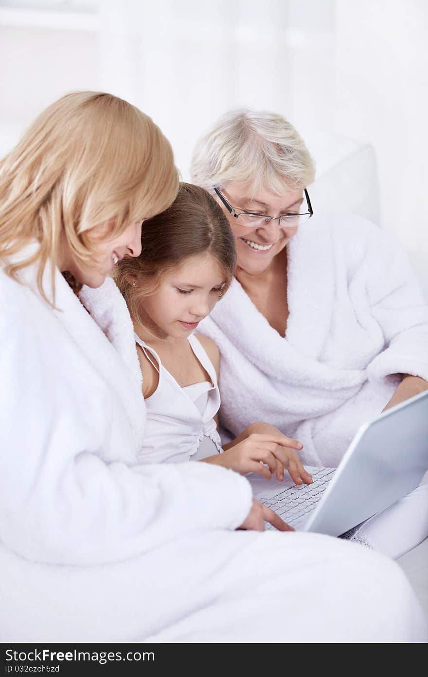 Grandmother, mother and daughter with laptop. Grandmother, mother and daughter with laptop