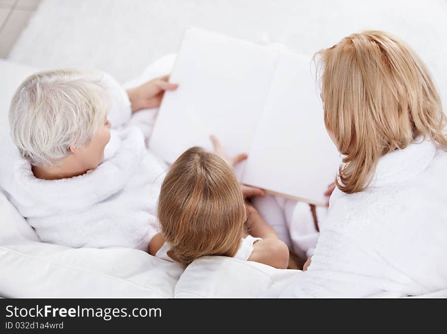 Family child reads a book. Family child reads a book