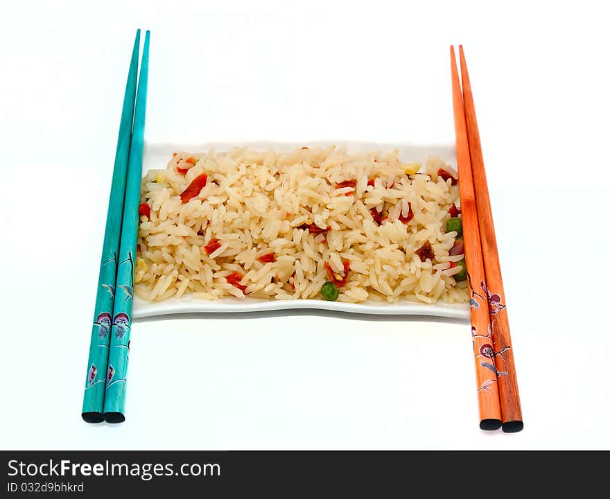 A Plate Of Rice And Chopsticks Isolated On White