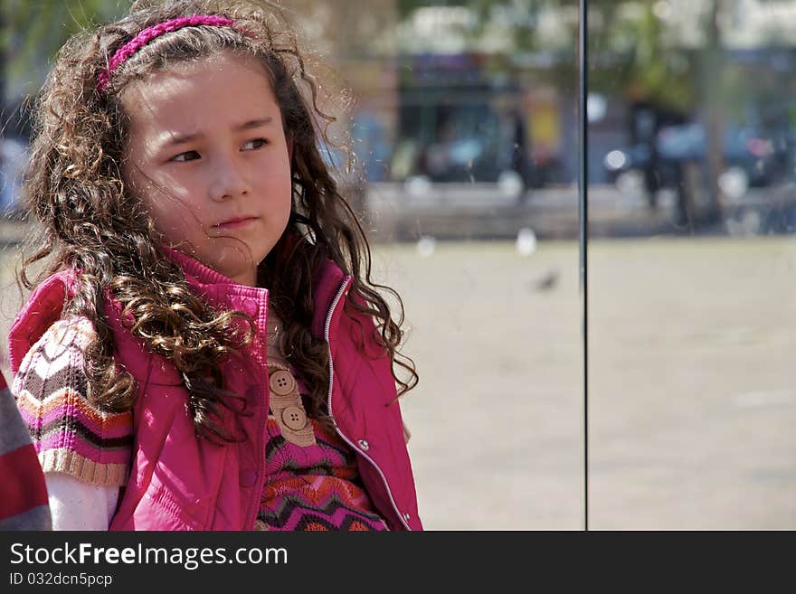 Young Girl Waiting at Bus Stop