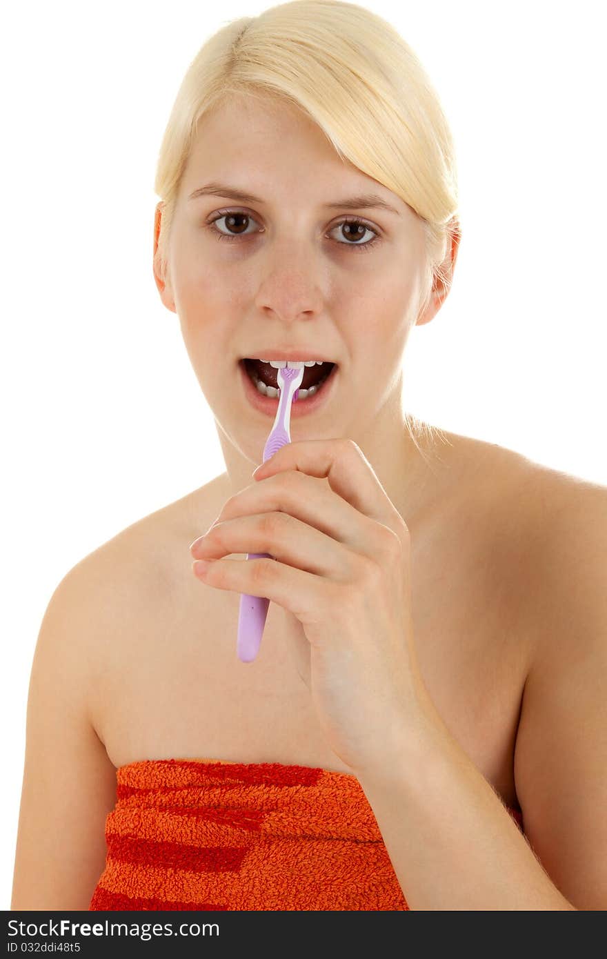 A young girl is brushing her teeths. A young girl is brushing her teeths