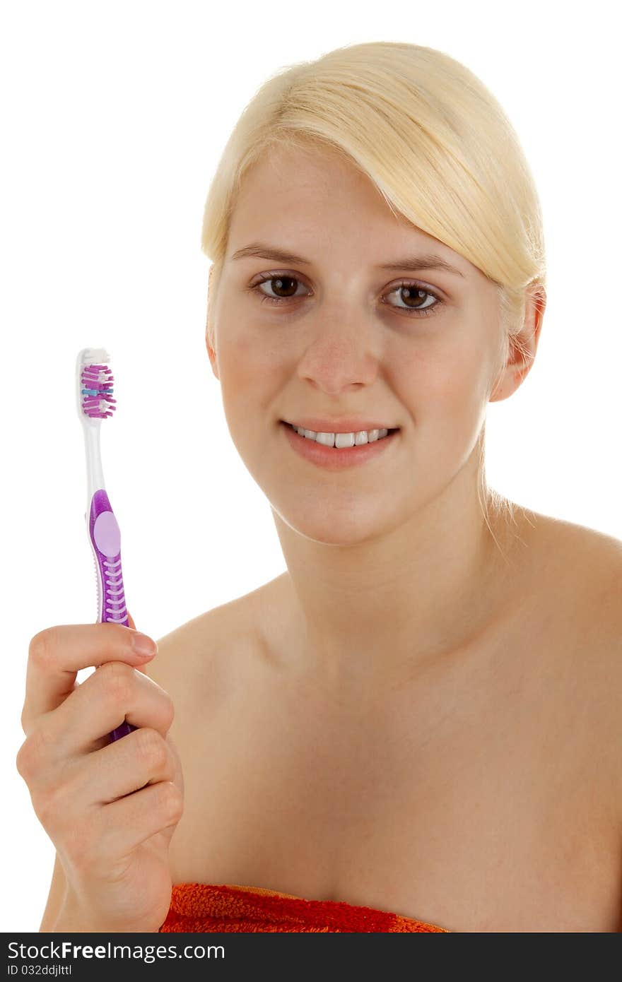 A young girl is brushing her teeths. A young girl is brushing her teeths