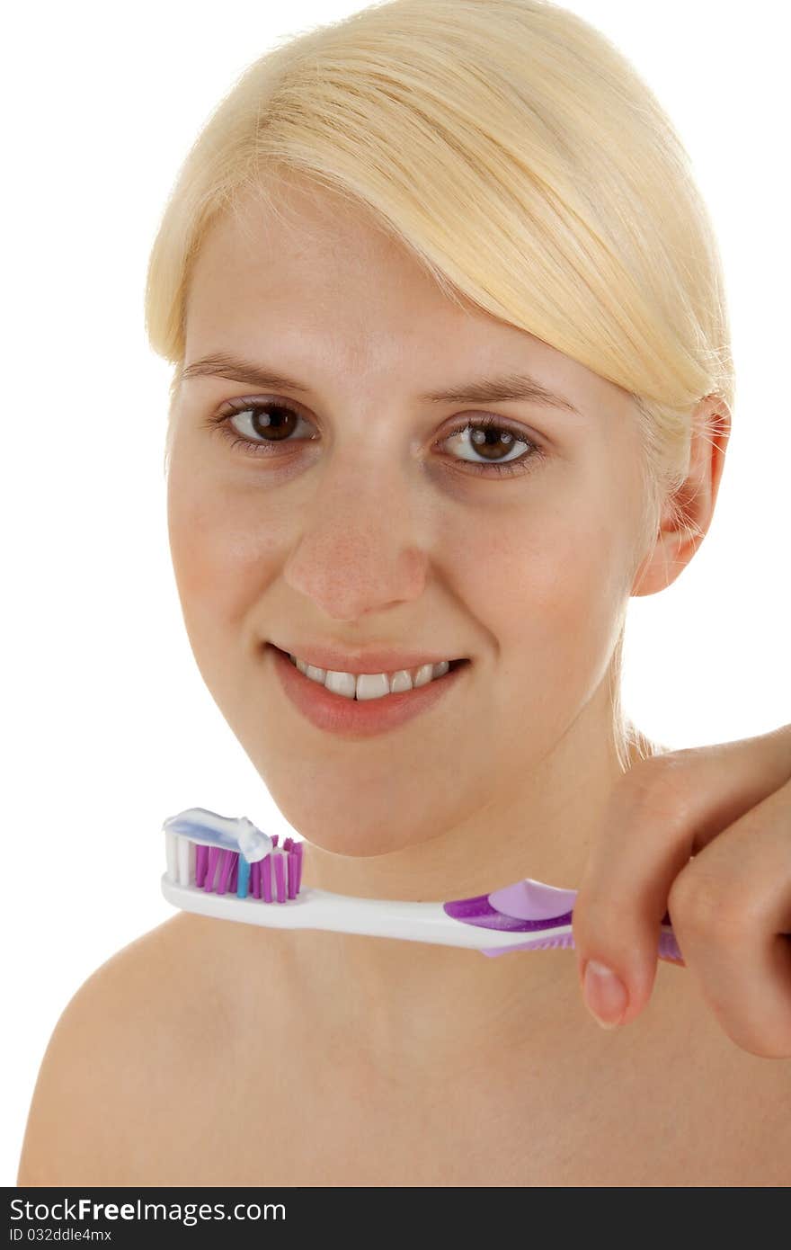 A young girl is brushing her teeths. A young girl is brushing her teeths