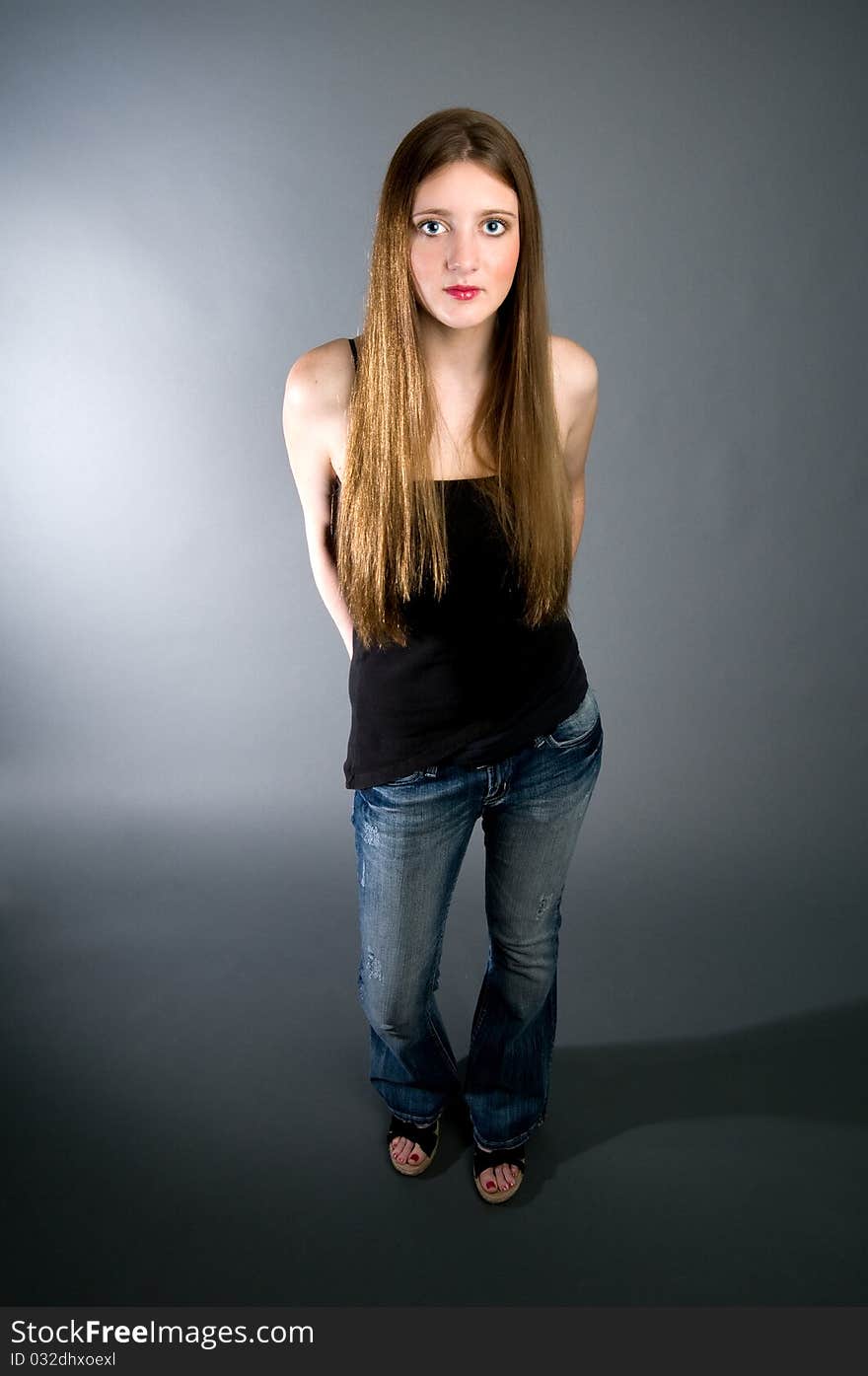 Teen model with black tank top and jeans