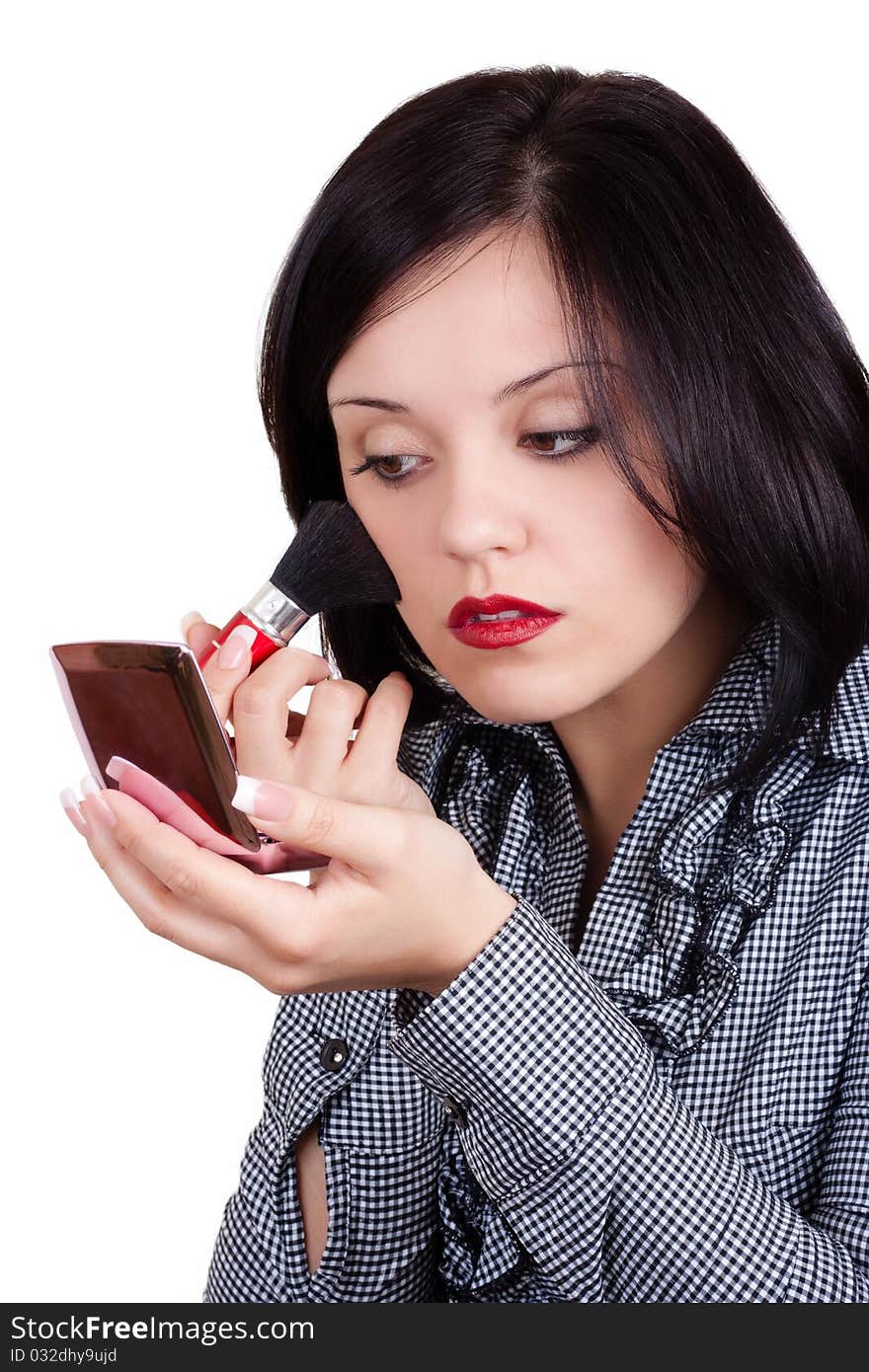 Young woman doing makeup