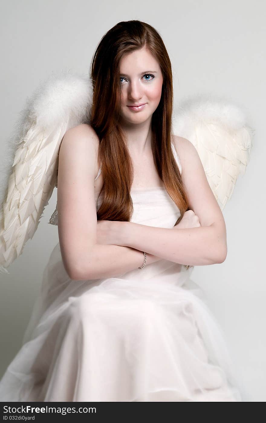 Rebellious angel with arms crossed