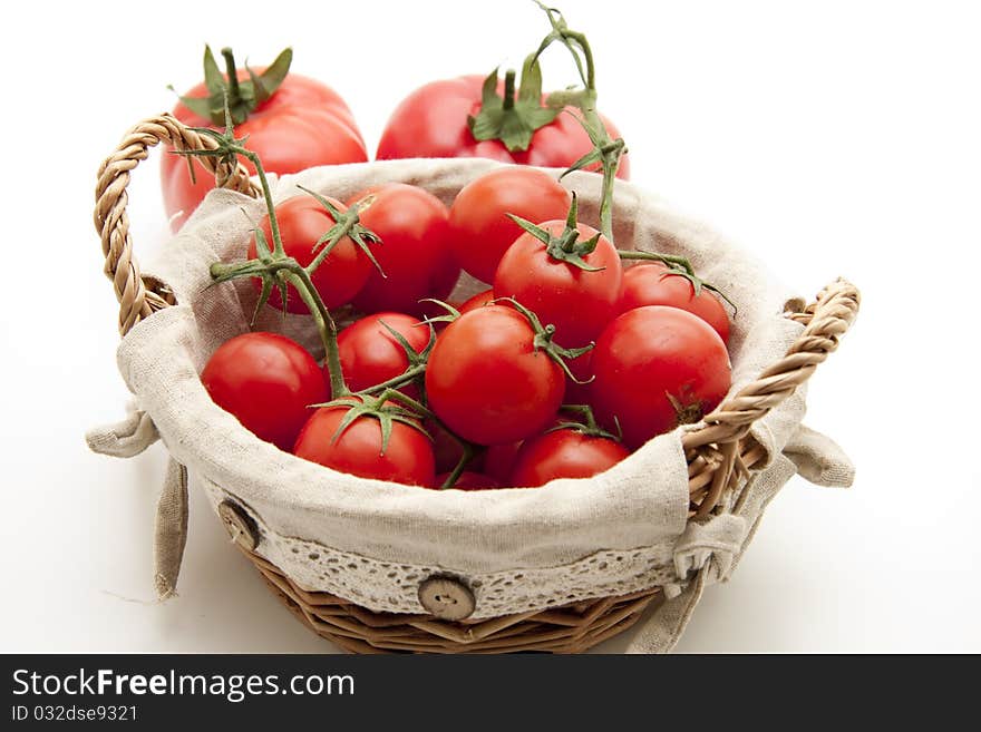 Cocktail tomatoes in the basket with material