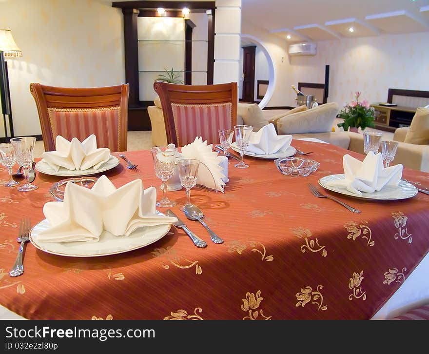 Dining table with red tablecloth. Dining table with red tablecloth