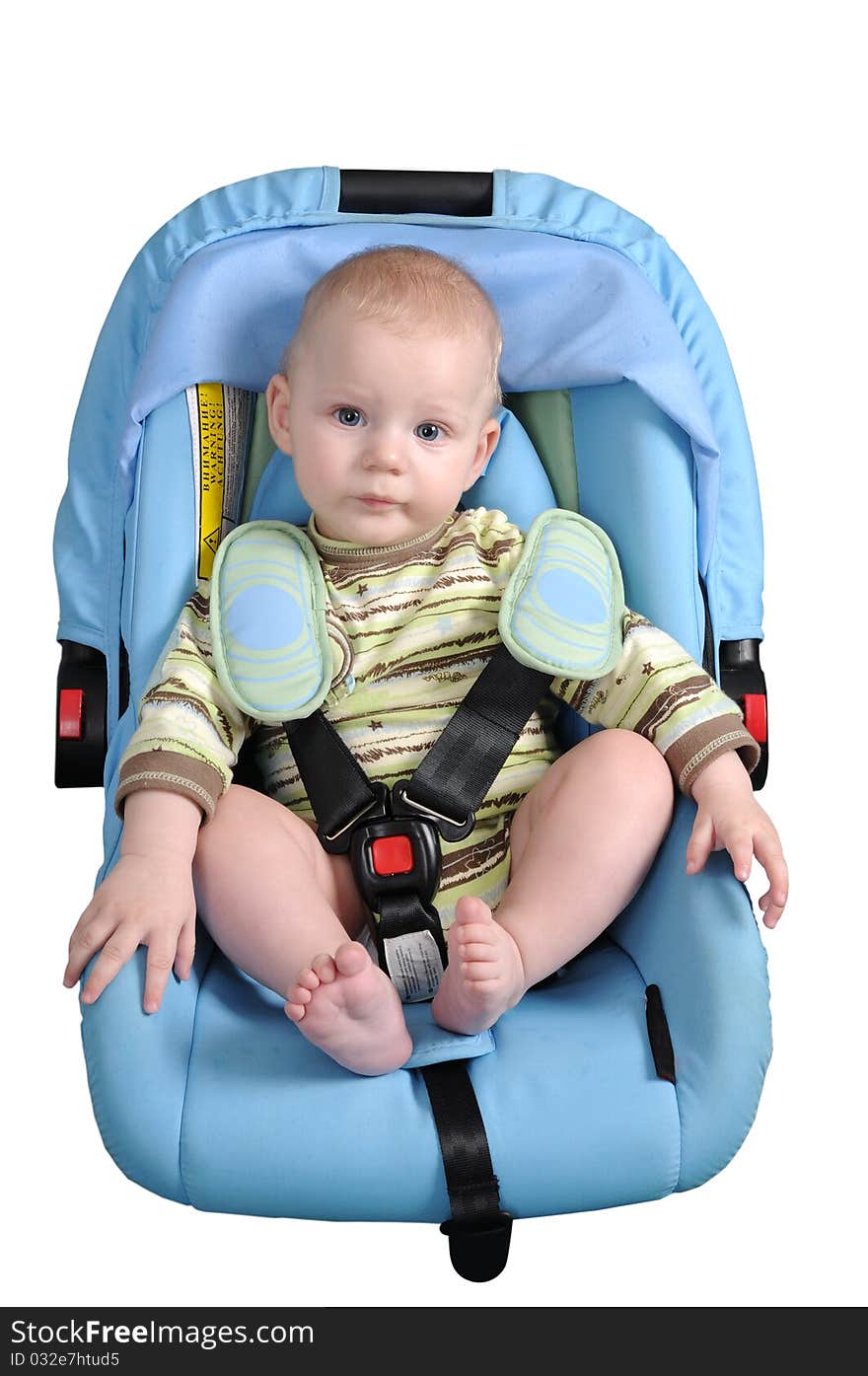 To the child seven months, he sits in a children's automobile armchair. To the child seven months, he sits in a children's automobile armchair.