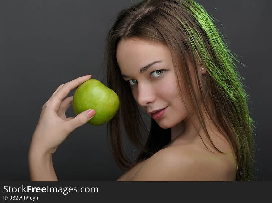 Beautiful woman posing with apple. Beautiful woman posing with apple