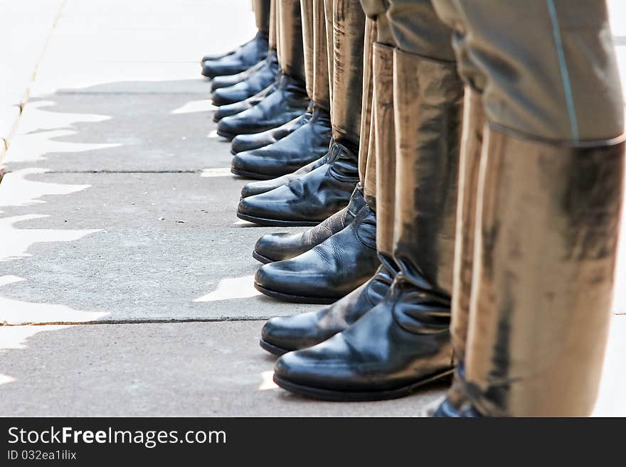 Line-up of soldiers in knee-boots on a parade. Line-up of soldiers in knee-boots on a parade