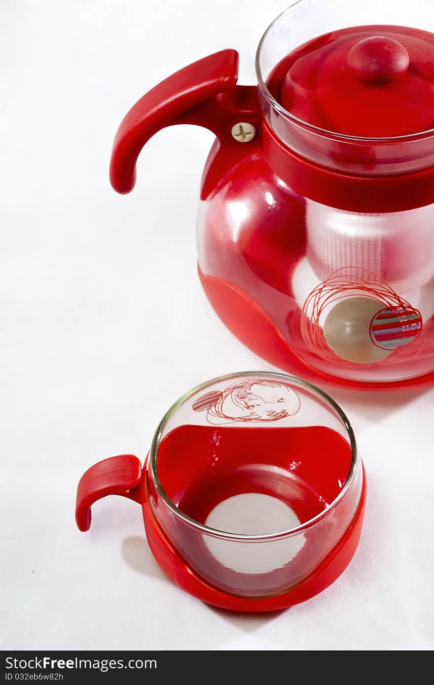 A red handle and a glass coffee cup coffee pot locally. A red handle and a glass coffee cup coffee pot locally