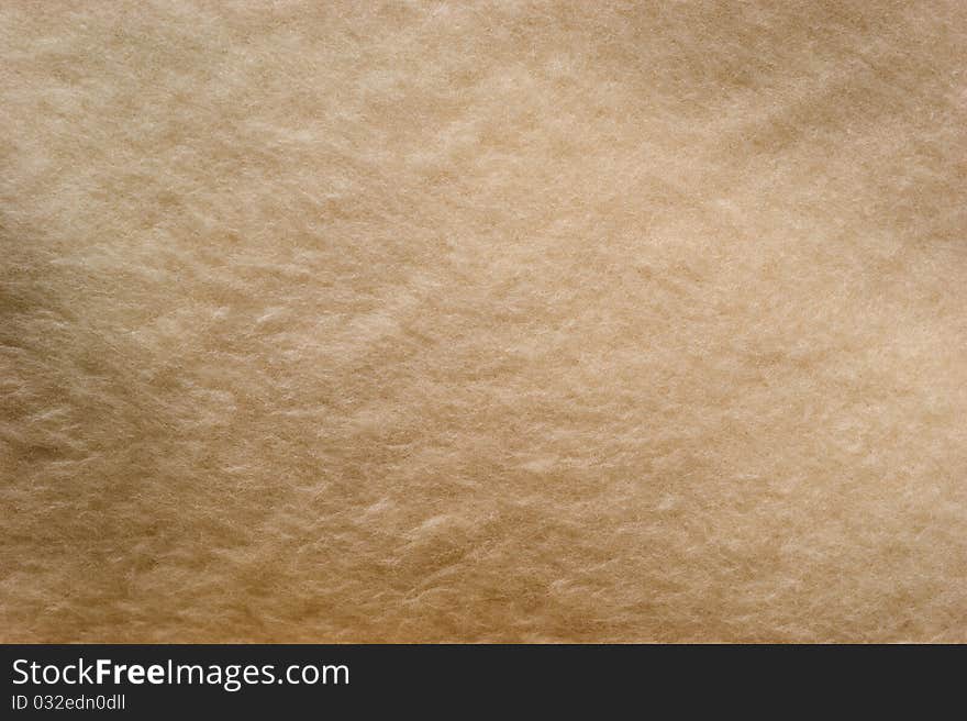 The background of textured bright synthetic fabric closeup