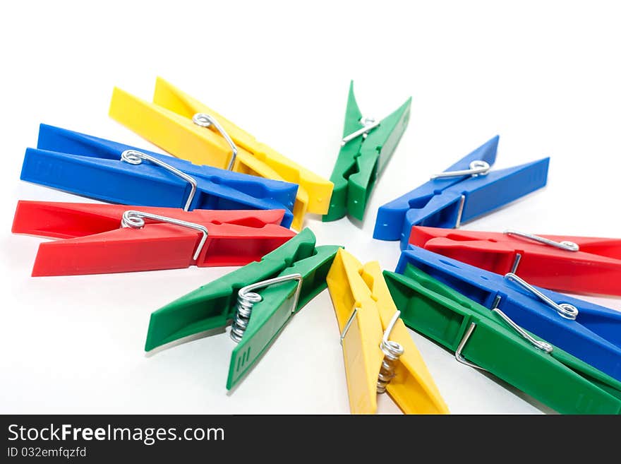 Many colored clothespin isolated on white background