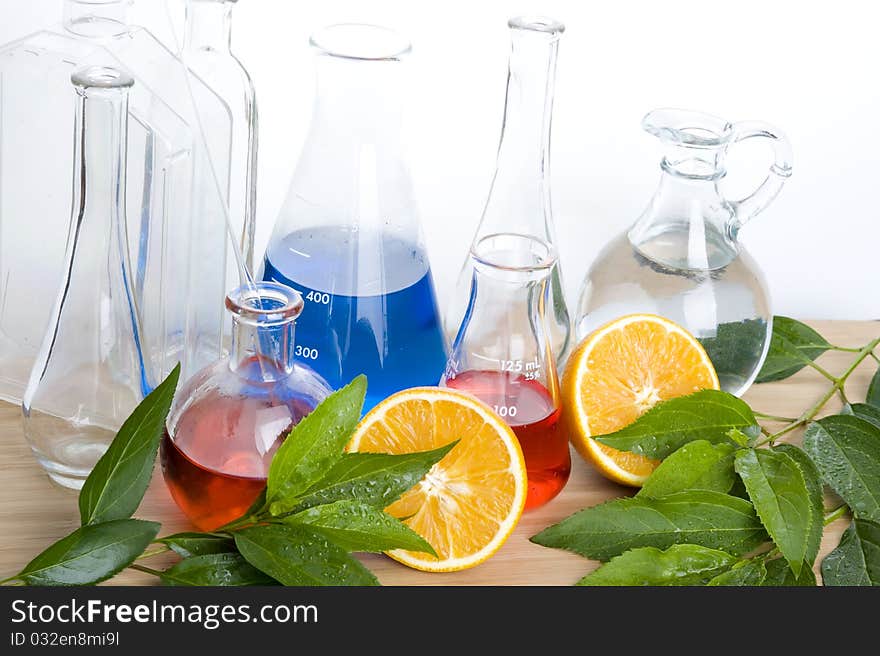 Laboratory flask and orange