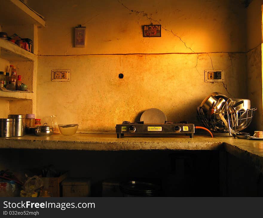 A traditional old Indian style generic kitchen photograph with sunburst colors. A traditional old Indian style generic kitchen photograph with sunburst colors.