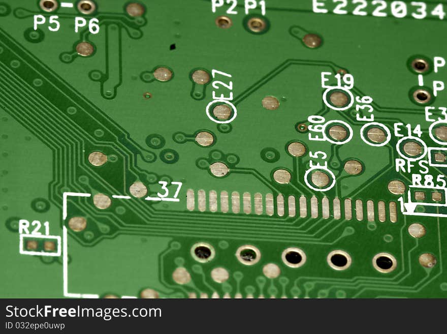 Close view detail of a green computer circuit board.