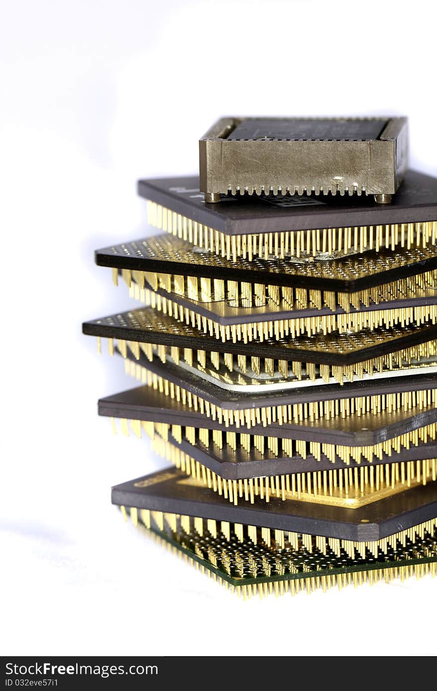 Close view detail of some computer microprocessors isolated on a white background.