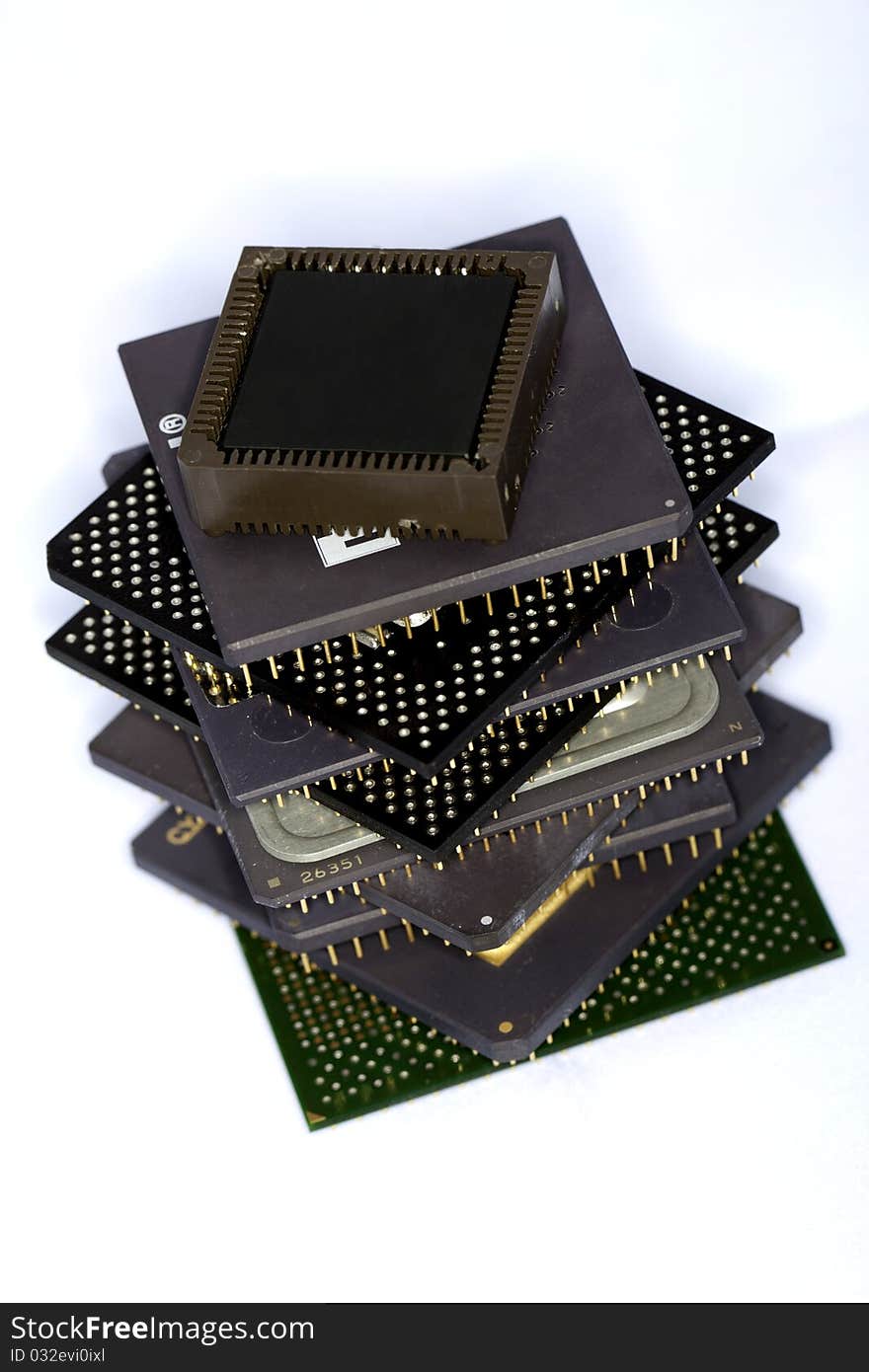 Close view detail of some computer microprocessors isolated on a white background.