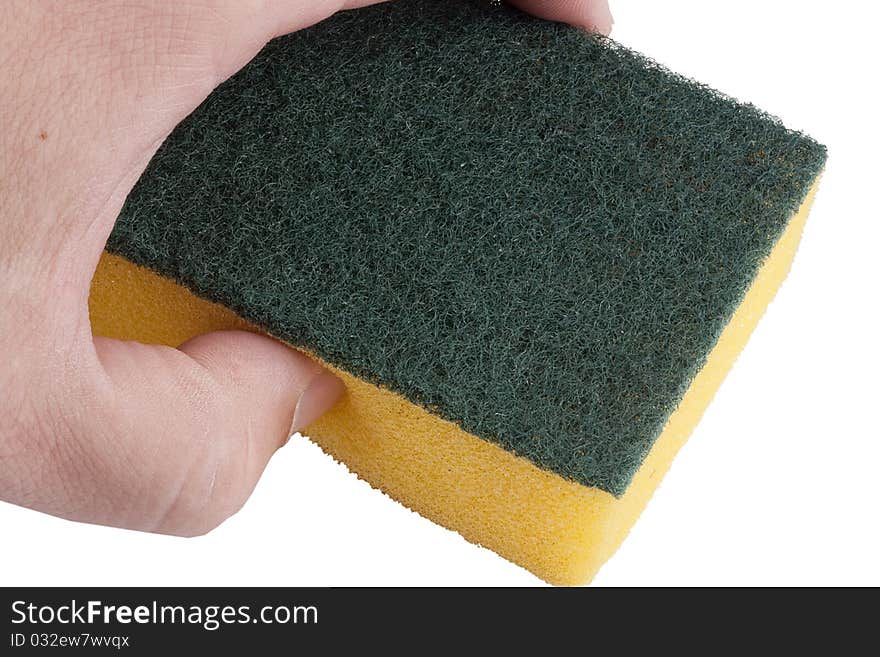 Yellow synthetic sponge for cleaning the men's hand.