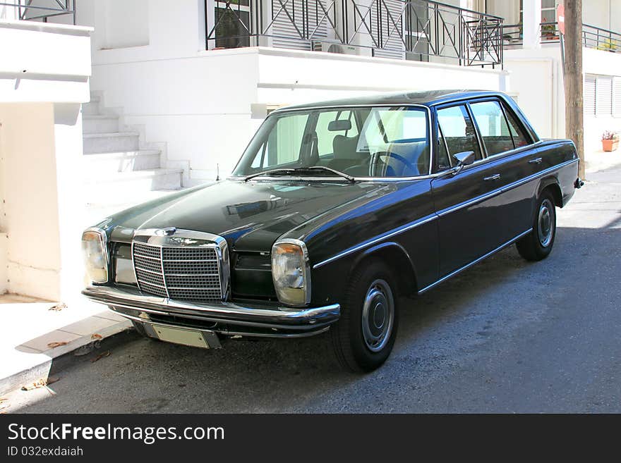 Black retro car. Standing in the street. Black retro car. Standing in the street