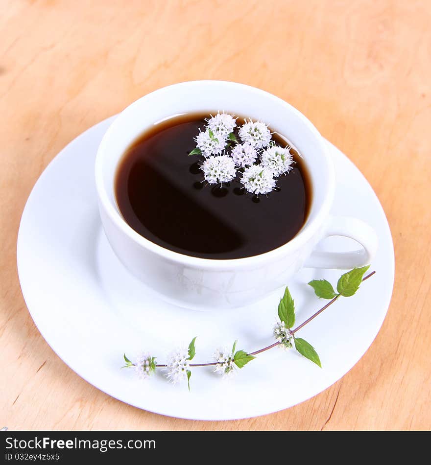 Tea with flowers of peppermint