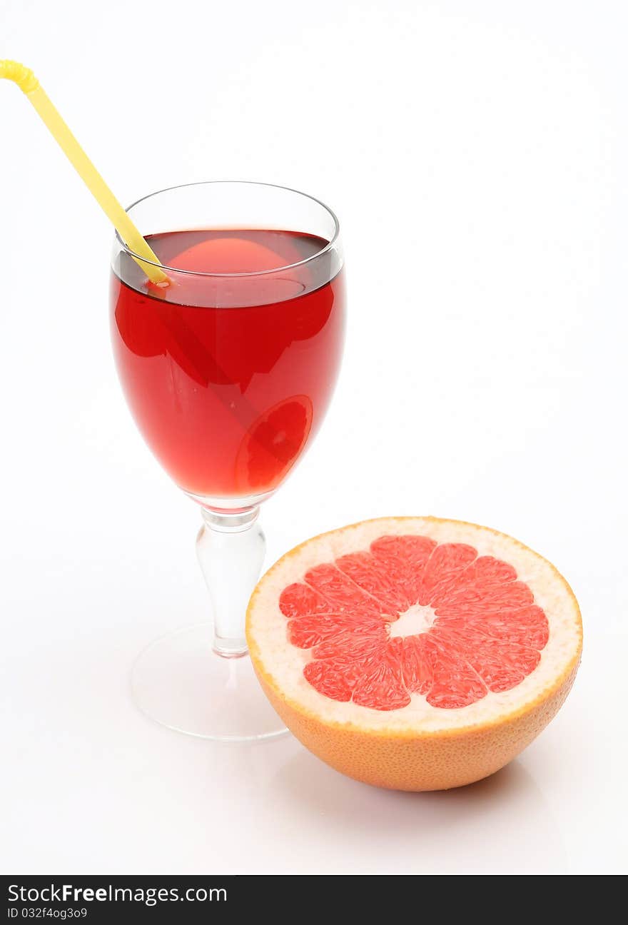 Ripe fruit and juice on a white background