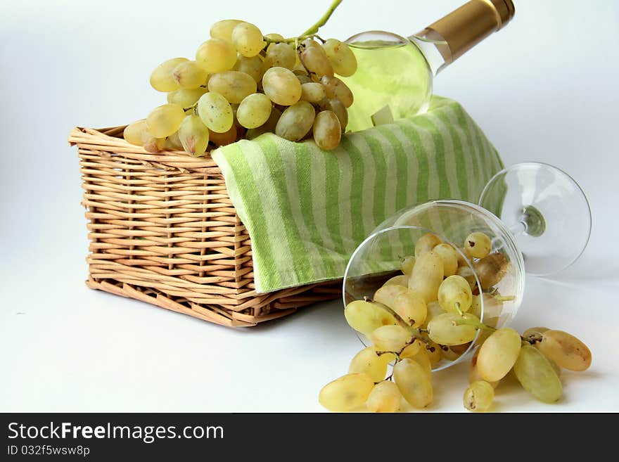 White grapes in a glass and white wine