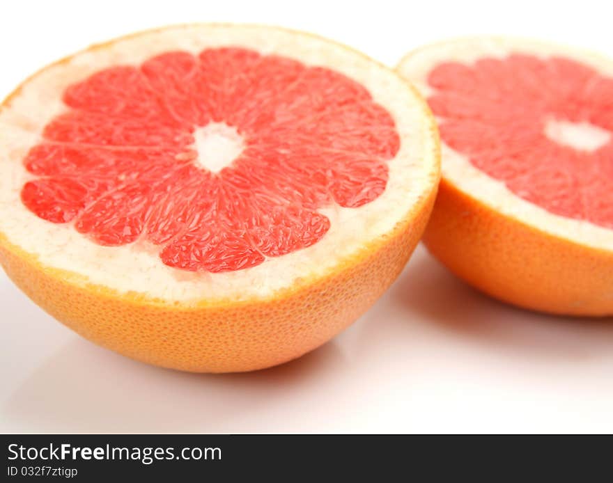 Ripe fruit and juice on a white background