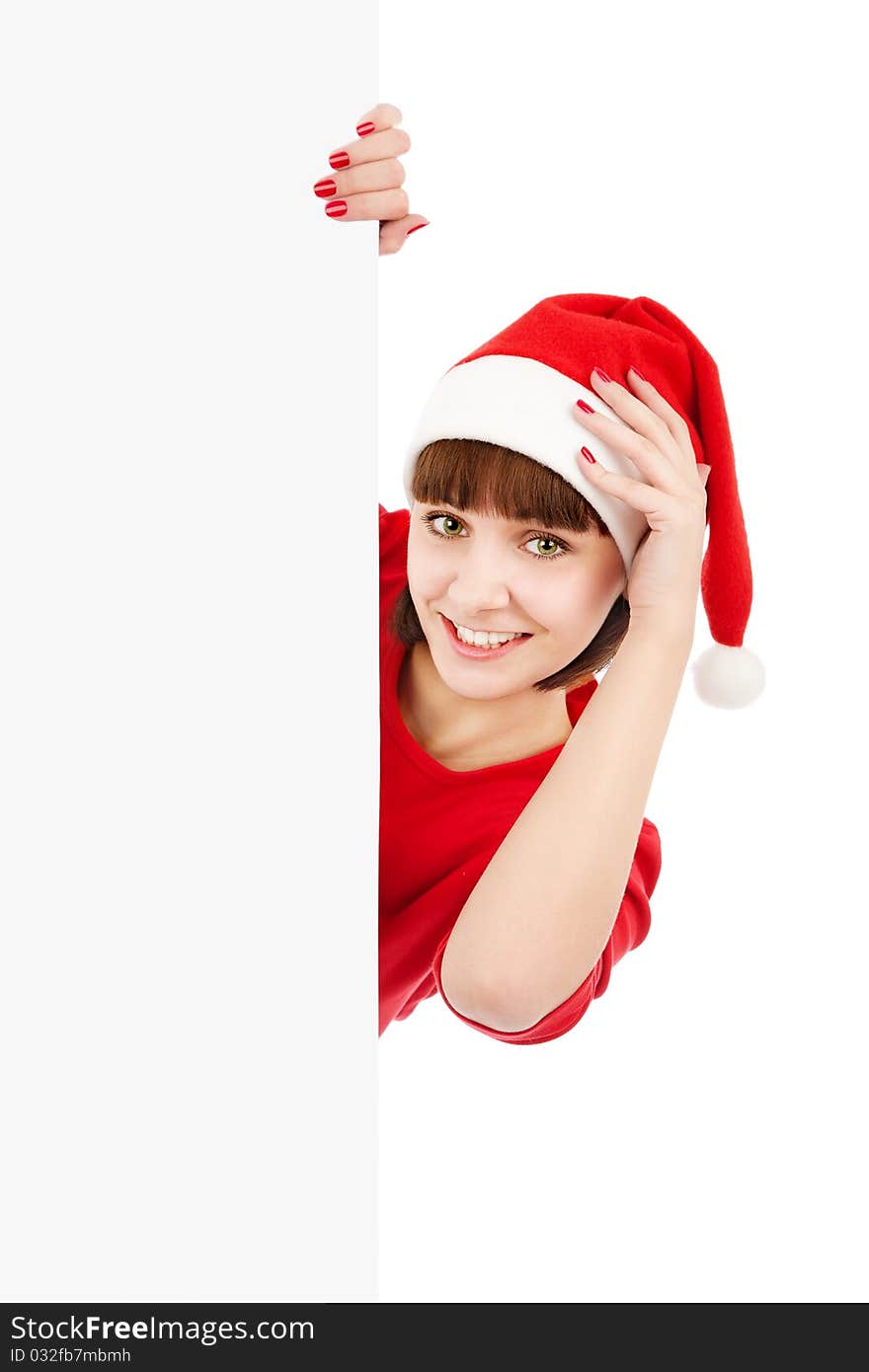 Smiling woman in Santa red hat holding blank sign billboard, isolated on white. Smiling woman in Santa red hat holding blank sign billboard, isolated on white