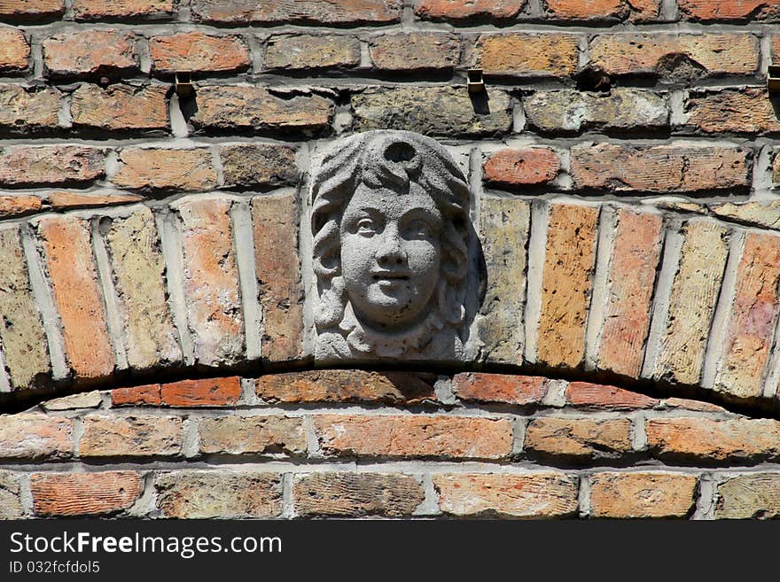 One of the many concrete faces found on the buildings from the 1700's in Brugge, Belgium. The faces on the buildings of that time were thought to keep away evil spirits. One of the many concrete faces found on the buildings from the 1700's in Brugge, Belgium. The faces on the buildings of that time were thought to keep away evil spirits.