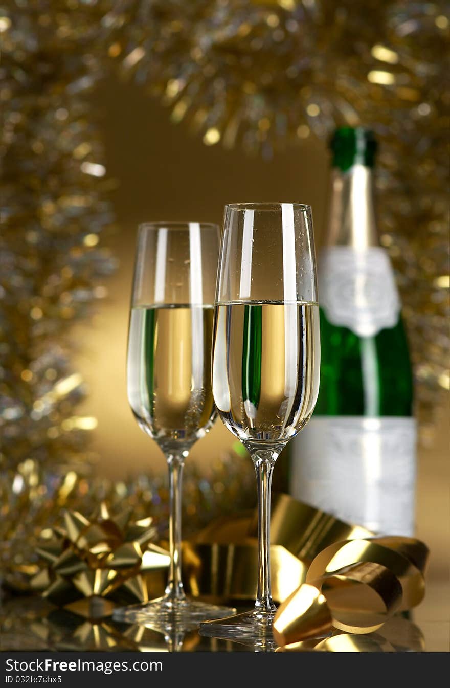 Champagne in glasses on a yellow background. Champagne in glasses on a yellow background