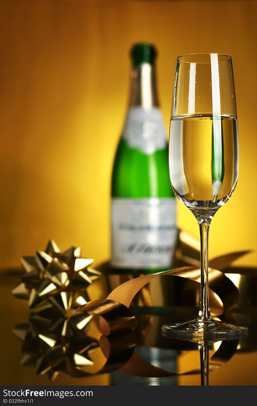 Champagne in glasses on a yellow background. Champagne in glasses on a yellow background