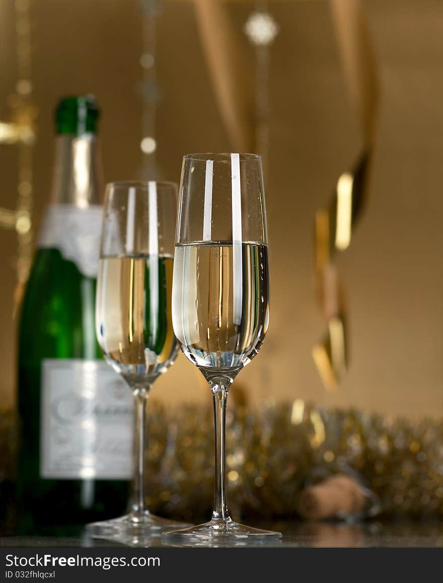 Champagne in glasses on a yellow background. Champagne in glasses on a yellow background