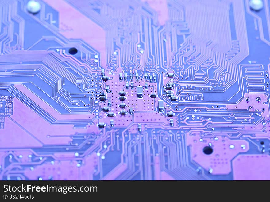 A close up shot of the backside of a computer circuit board, also known as a motherboard. A close up shot of the backside of a computer circuit board, also known as a motherboard