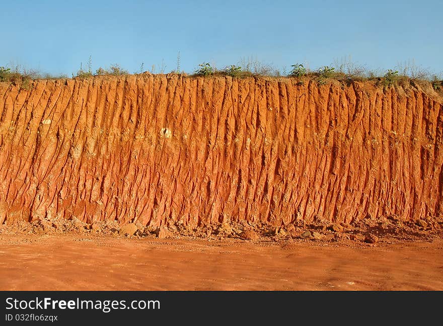 Texture of soil profile with blue sky