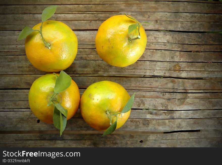 Fresh orange on wood background