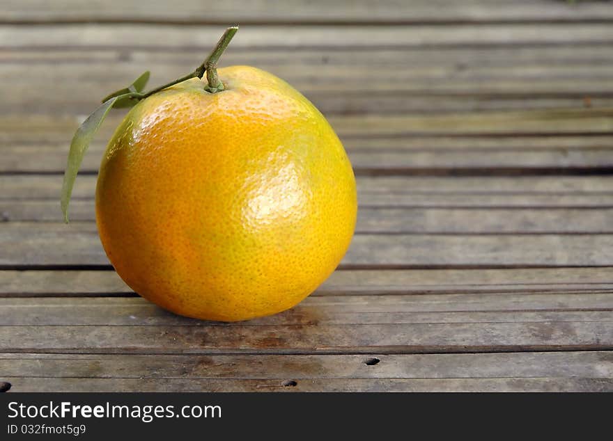 Fresh orange on wood background