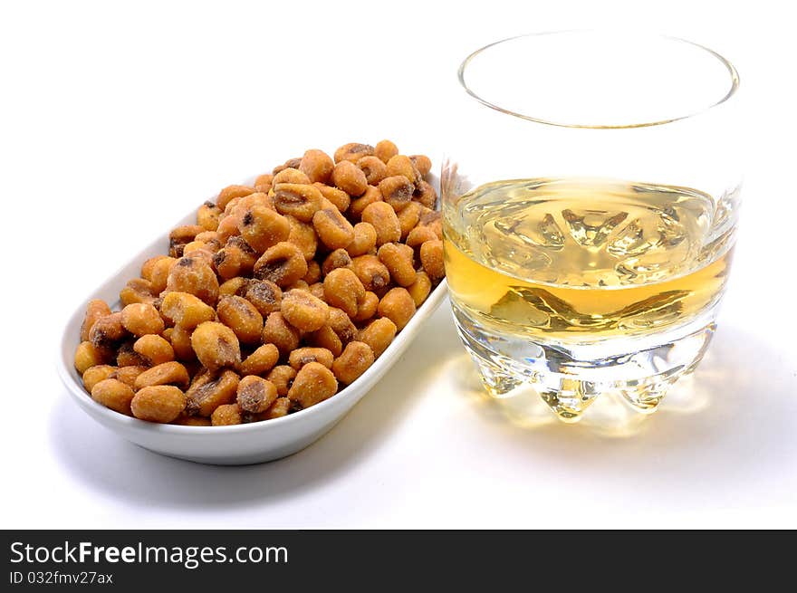 Fried corn presented on a dish over a white background. Fried corn presented on a dish over a white background