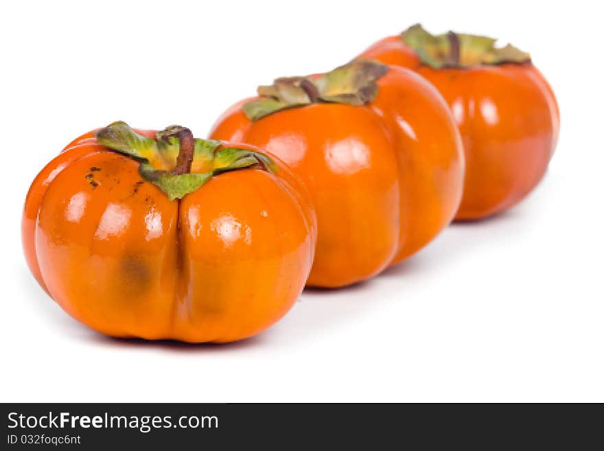 Ripe persimmons isolated on a white background