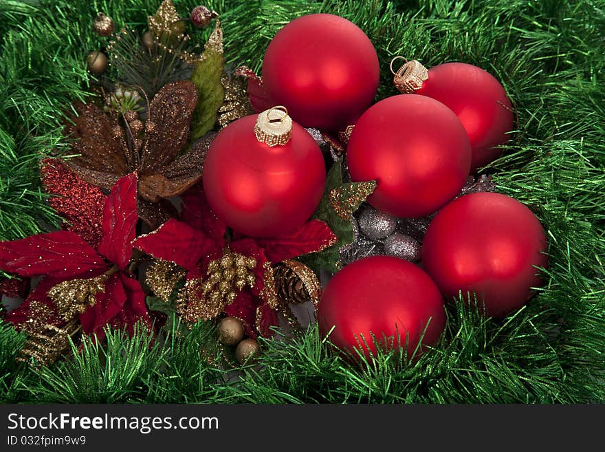 Christmas Red Balls On Green Decorated Background