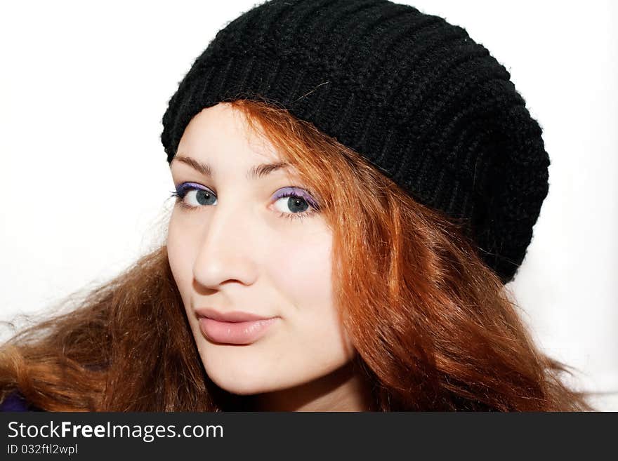 Portrait of a beautiful girl in the hat