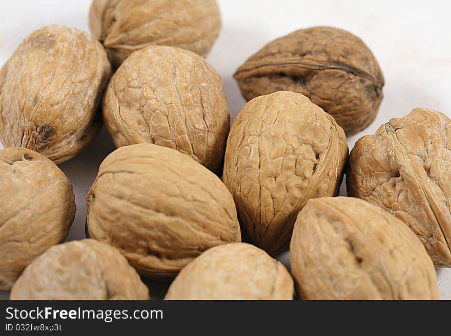 Close up of many walnuts.