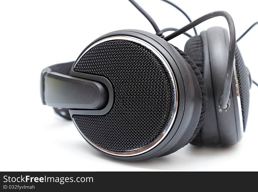 Isolated headphones in black on a white background close up. Isolated headphones in black on a white background close up