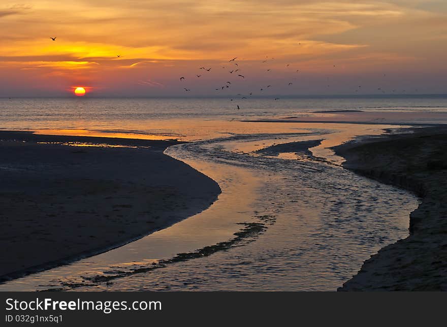 Dramatic and colorful sunrise in the gulf of Riga