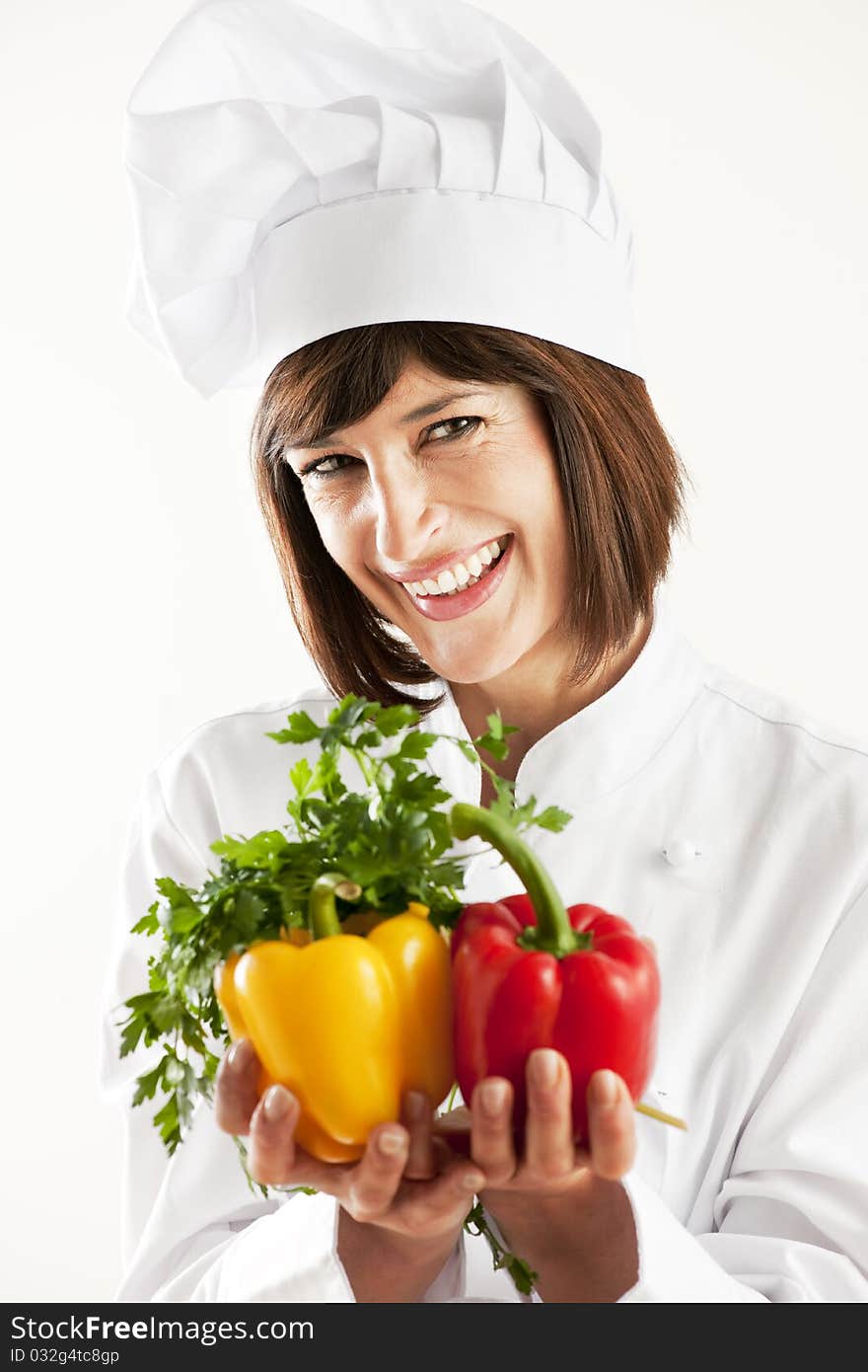 Cheerful Female Chef With Vegetables