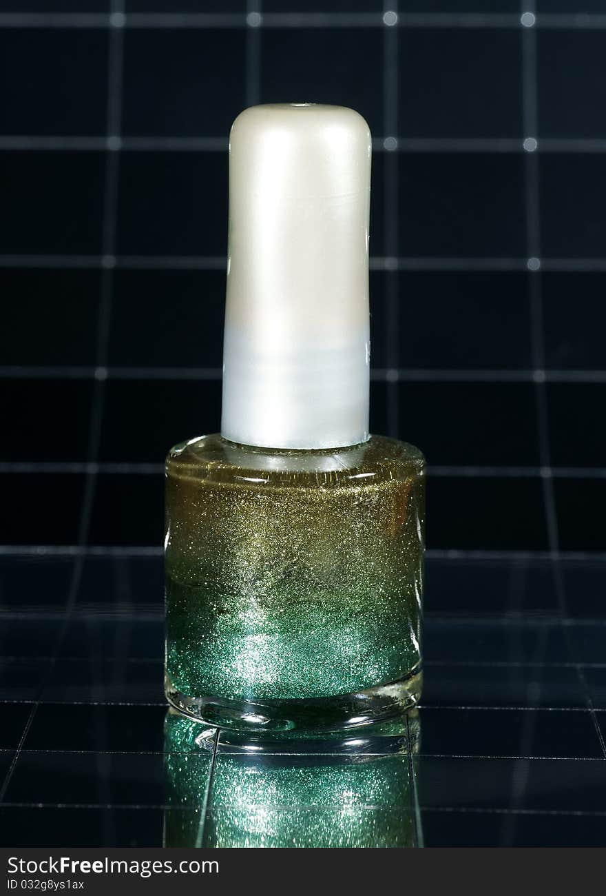 Nail polish green nacre with reflexion