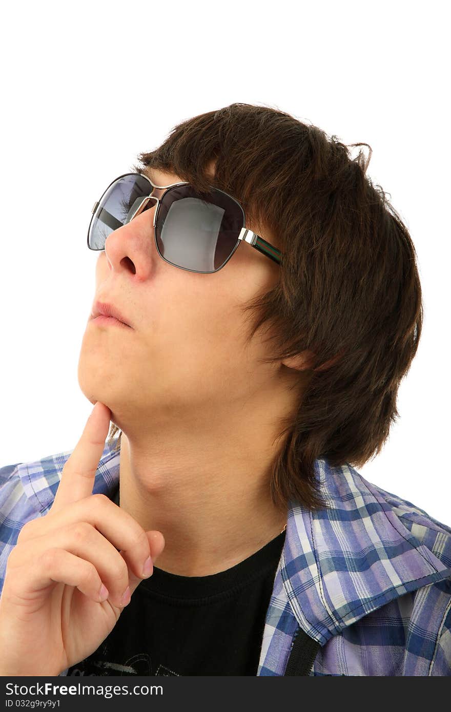 Portrait of thoughtful young man in sunglasses against white background. Portrait of thoughtful young man in sunglasses against white background