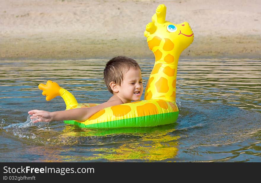 Child Swims In The River