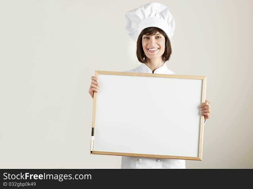 Beautiful female Chef with Blackboard. Beautiful female Chef with Blackboard